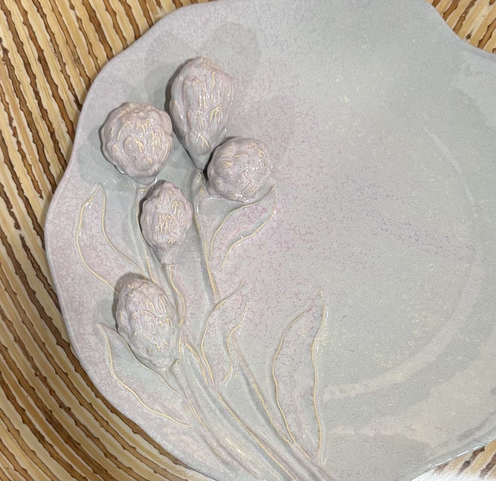 Ceramic plates with floral relief patterns by Amato